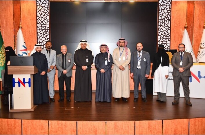 Dr. Mohamed Salama with healthcare professionals on stage