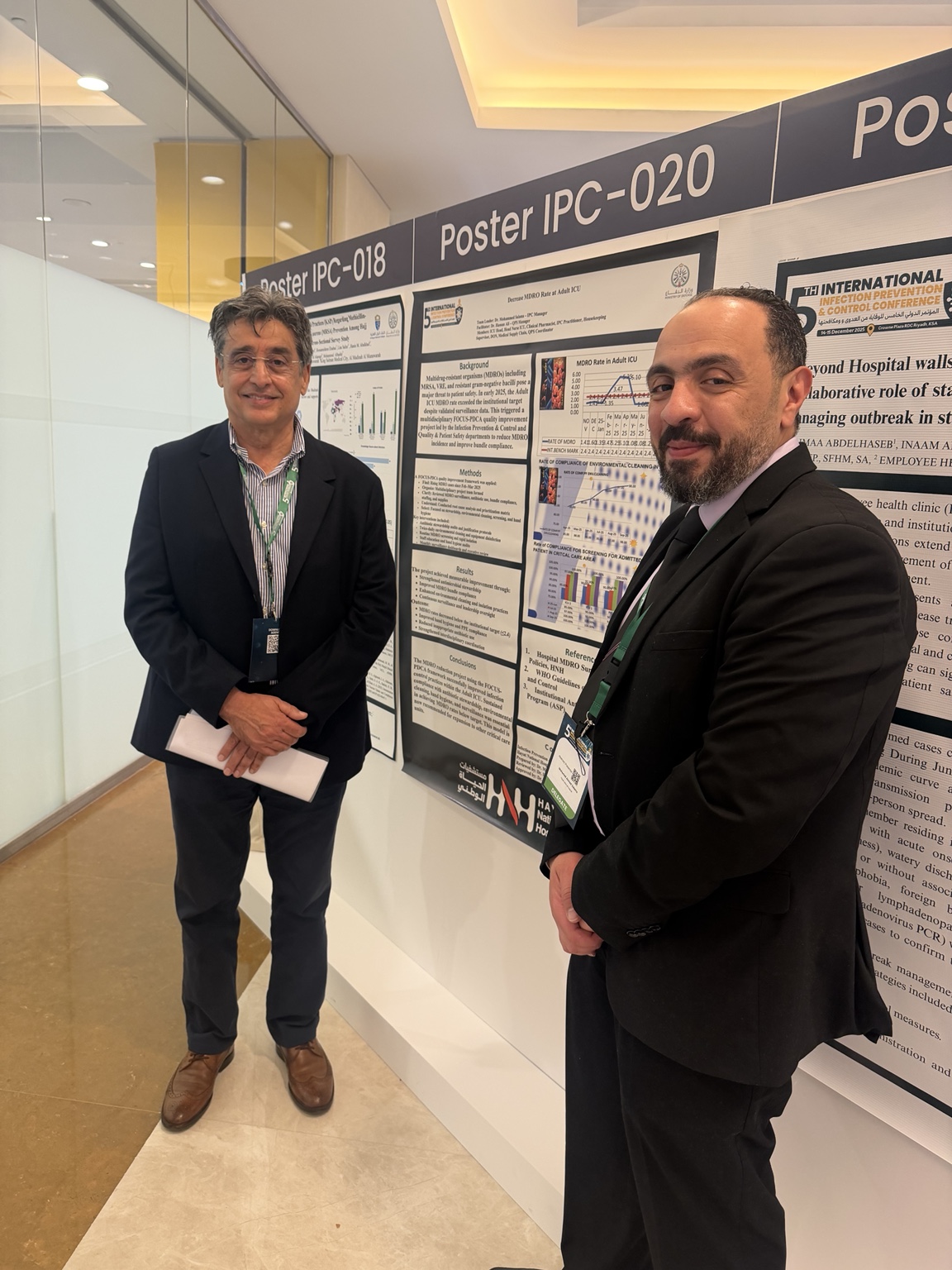 Dr. Mohamed Salama beside the MDRO improvement poster